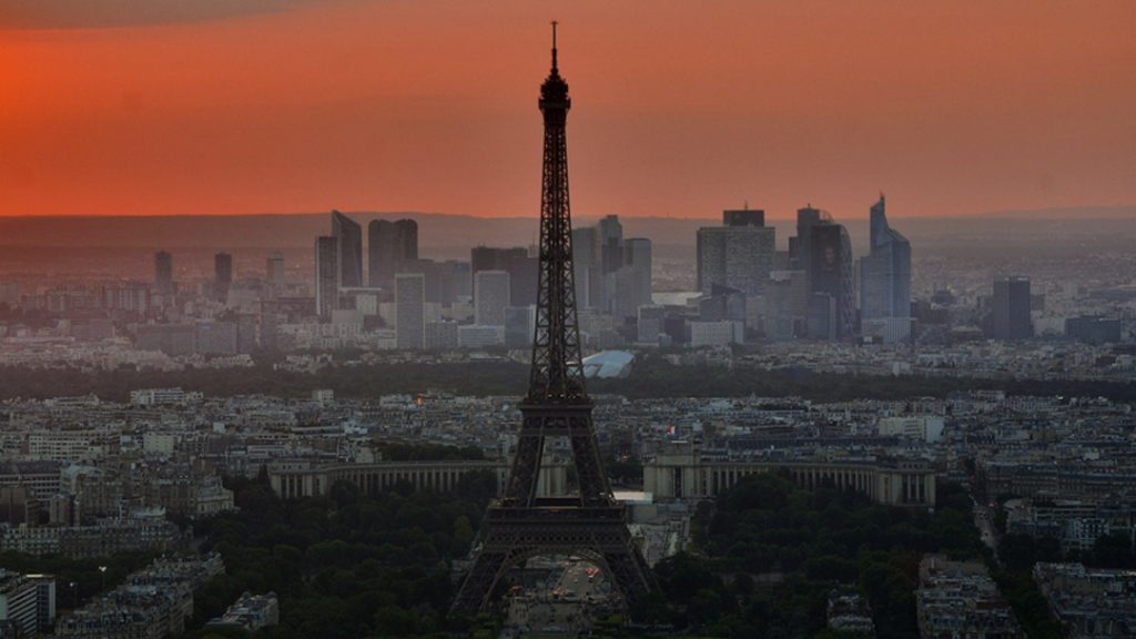 The Eiffel Tower under a dark red sky